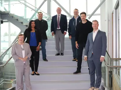 West Kelowna mayor and council post on the main staircase at City Hall.