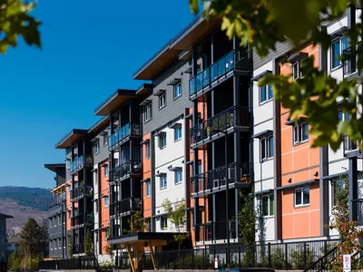 colourful six story apartment building on a sunny day