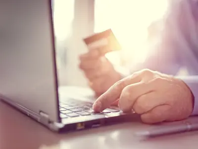 online-shopping-with-credit-card-and-laptop-comput-PD7VT6A.jpg